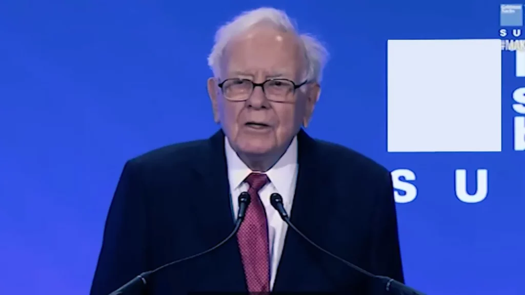Warren Buffett in a black suit and he is the oldest person in the list of top 10 richest person in the world.
